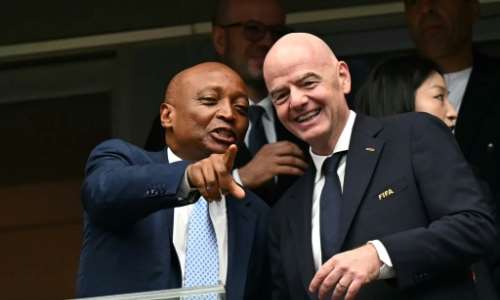 Patrice Motsepe (left) said Gianni Infantino had remained loyal to Africa.  By Paul ELLIS (AFP/File)
