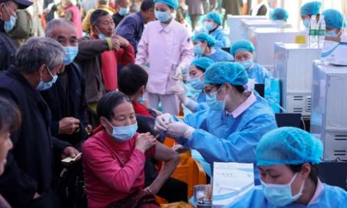 People receive Covid-19 vaccines in China's southwestern city of Chongqing. By STR (AFP/File)