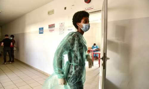 Poll workers wore protective personal equipment as Cape Verde battles a surge in coronavirus cases. By Seyllou (AFP)