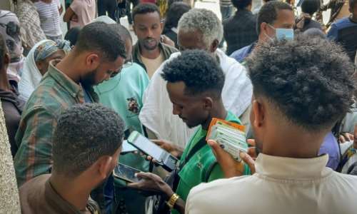 Tigrayan locals flocked to buy new sim cards amid a telecoms shutdown.  By - (AFP)
