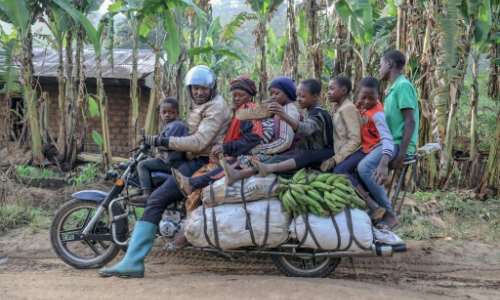 What, no kitchen sink? A giant motorbike in Cameroon takes a driver, six passengers and plenty of luggage. By Daniel Beloumou Olomo (AFP)
