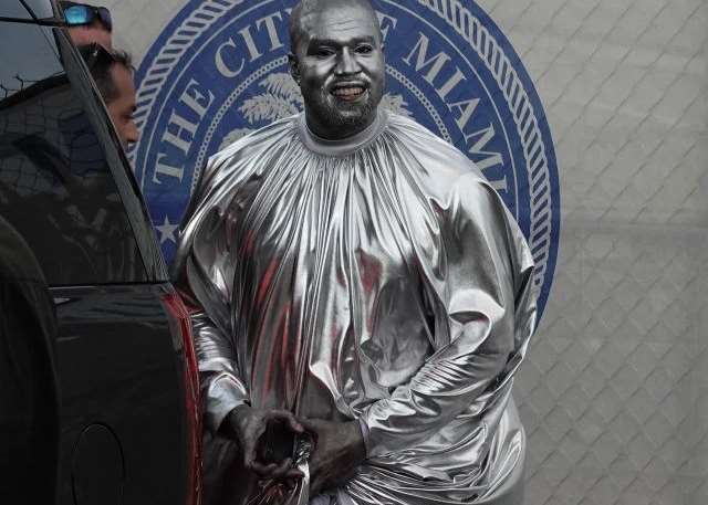 kanye dressed in silver Kanye West Paints Himself Head-To-Toe For Opera's Debut