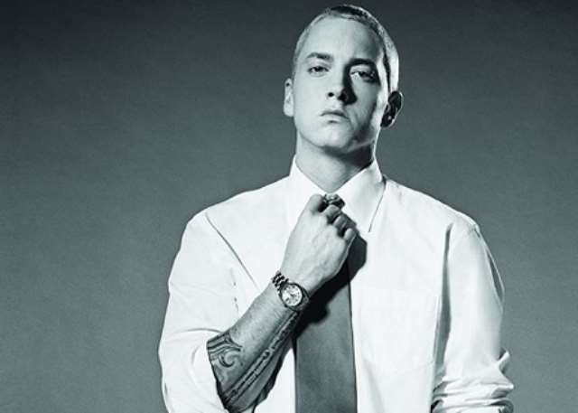 white dress party eminem A viral video features a bride in a white wedding dress passionately rapping Eminem's "Without Me" inside a car before her wedding, blending hip-hop energy with bridal excitement. This clip, shared widely