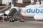 Travelers board a FlyDubai aircraft at Ben Gurion International Airport after a separate FlyDubai flight from the United Arab Emirates to Israel was diverted to Saudi Arabia following an emergency signal, in Lod, near Tel Aviv, Israel on September 30, 2026. -  Ammar Awad, Reuters