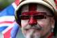 A protester, with his face painted in the colours of the flag of England, takes part in a Unite the Kingdom rally organised by British anti-immigration activist Tommy Robinson, in London, May 16, 2026. - REUTERS - Hannah McKay
