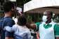 A health official uses a thermometer to screen people in front of Kibuli Muslim Hospital in Kampala, Uganda, Saturday, May 16, 2026. -  Hajarah Nalwadda, AP