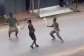3 young guys engaging in machete fight