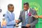 Health Minister receiving the report from investigative committee chair