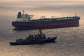 This US Navy handout photo released on May 8, 2026 by US Central Command Public Affairs shows the Arleigh Burke-class guided-missile destroyer USS Rafael Peralta (DDG 115) implementing a maritime blockade against the Iran-flagged crude oil tanker vessel Herby as it was attempting to sail toward an Iranian port, April 24, 2026. -  AFP