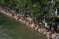 As temperatures soar across France, people have taken to swimming in rivers, lakes or canals, like here in the Canal Saint-Martin, in eastern Paris. Authorities warn not to swim in unauthorised areas. -  Arnaud Finistre/AFP