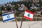 Representations of the Israeli and Lebanese flags at a memorial near the Israel-Lebanon border, after Israel and Lebanon signed a framework agreement following U.S.-mediated talks, as the town of Metula, Israel, appears in the distance, June 27, 2026. -  Amir Cohen, Reuters