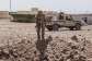 A soldier from the National Front for the Liberation of Azawad (FLA) inspects a crater in Kidal on May 14, 2026 caused by aerial bombardment from Malian Armed Forces (FAMA). -  AFP