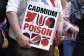 A French MP holds a placard reading cadmium, poison during a protest ahead of a debate at the National Assembly of their bill, which aims at limiting exposure to cadmium in Paris on 2 June, 2026. - AFP - SIMON WOHLFAHRT