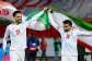 AFP via Getty Images: Iran players Omid Norafkan and Saman Ghoddos celebrate after a qualifying match in 2025