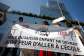 Demonstrators hold a banner reading No child should be afraid to go to school as they take part in a gathering in front of the criminal court of Paris, called by the #MeeTooEcole collective, ahead of the opening day for the trial of an after-school staff member, accused of sexually assaulting preschool pupils, in Paris on May 26, 2026. -  Simon Wohlfahrt, AFP