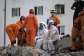 Argentine rescue workers prepare to recover bodies from a collapsed building in the Tanaguarena sector of Caraballeda, La Guaira state, Venezuela, on July 10, 2026. -  Juan Barreto, AFP