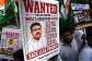 Indian Youth Congress party workers hold placards of Indias Education Minister Dharmendra Pradhan during a protest  over the alleged NEET exam irregularities in Mumbai on June 2, 2026. -  Indranil Mukherjee, AFP