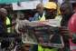 A Kenyan reads national daily newspaper The Standard, with a headline reporting the election of Kenyas 5th President elect William Ruto, in Eldoret, in August 2022. - AFP - SIMON MAINA