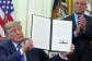 President Donald Trump holds a signed executive order about vaccines as Health and Human Services Secretary Robert F. Kennedy Jr. watches on August 10, 2026. -  Jacquelyn Martin, AP