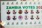A person writes down names from a banner displaying candidates for Zambias 2026 general election at the Mulungushi International Conference Centre ahead of the countrys general election on August 13, in Lusaka, Zambia, August 12, 2026. - REUTERS - Jean Mandela