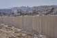 The separation wall next to the Arab neighbourhood of Al-Eizariya, near where the Israeli government says housing units will be built as part of the its E1 settler project, pictured on Thursday, August 21, 2025. -  Ohad Zwigenberg, AP