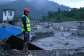 A rescue worker looks on at the site of damaged buildings in the aftermath of flash floods at Trishuli Bazar in Nepals Nuwakot district on August 29, 2026. -  Manan Vatsyayana, AFP