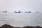 Commercial vessels are seen in the Strait of Hormuz off Bandar Abbas, Iran, 30 June 2026. -  Amirhosein Khorgooi, AP