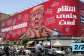 A woman walks past a large billboard pledging revenge against US President Donald Trump along Jomhouri Street in central Tehran on July 27, 2026. -  AFP