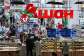 Customers shop for food in an Auchan supermarket in Aviapark shopping mall in Moscow on February 11, 2026. -  Hector Retamal, AFP