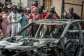 Suspects in the Johannesburg shooting torched two vehicles before fleeing.  By EMMANUEL CROSET (AFP)