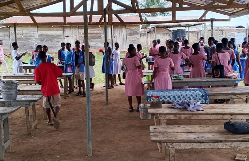 Dodi-Papase Senior High Technical School students eat in ope...