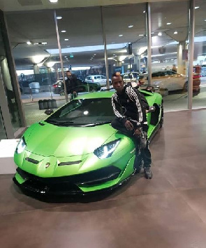 Patapaa Poses By A Brand New Lamborghini Car