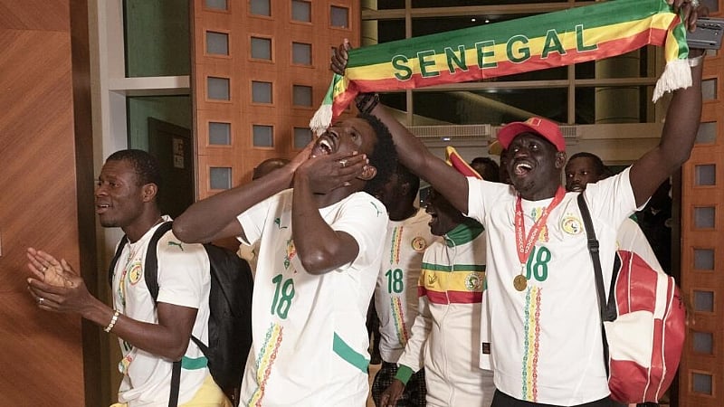 Senegal football fans return home after royal pardon for Cup of Nations chaos