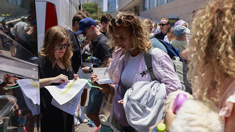 Governments scramble to evacuate their citizens from Israel,...