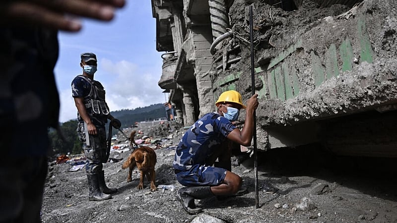 Nepal rescuers race to free dozens trapped in hydropower tunnels