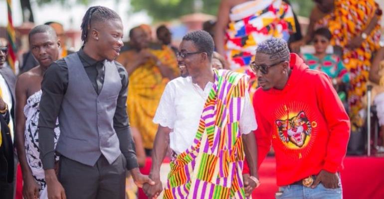 CEO of Zylofon Media, Nana Appiah Mensah (in Kente) with some of his signees, Stonebwoy, Shatta Wale