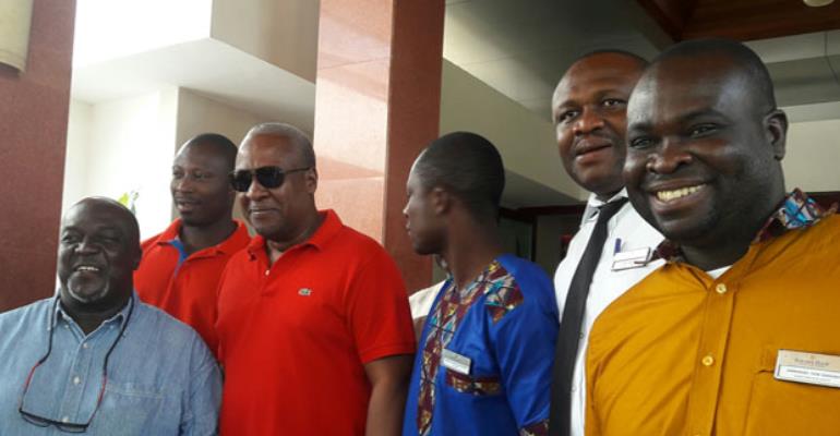 Former President Mahama in a photograph with some of his admirers