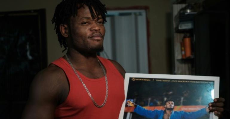 Far from Olympic glory, refugee fights humble battle