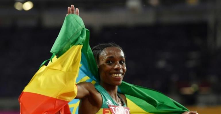 Ayana routs rivals to take world title
