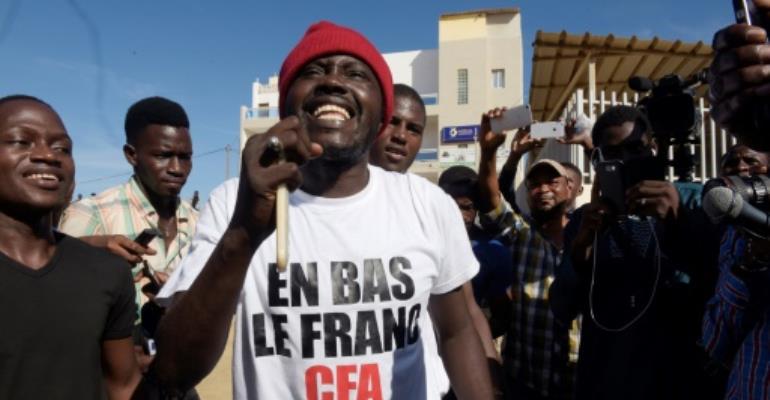 Senegal acquits activist for burning cash in anti-colonial protest