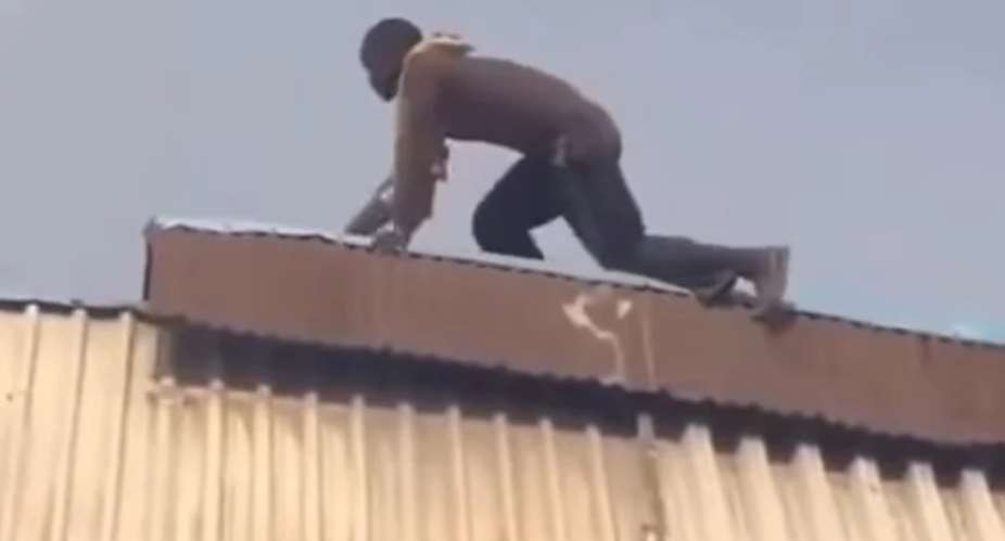 Suspect on top of the roof