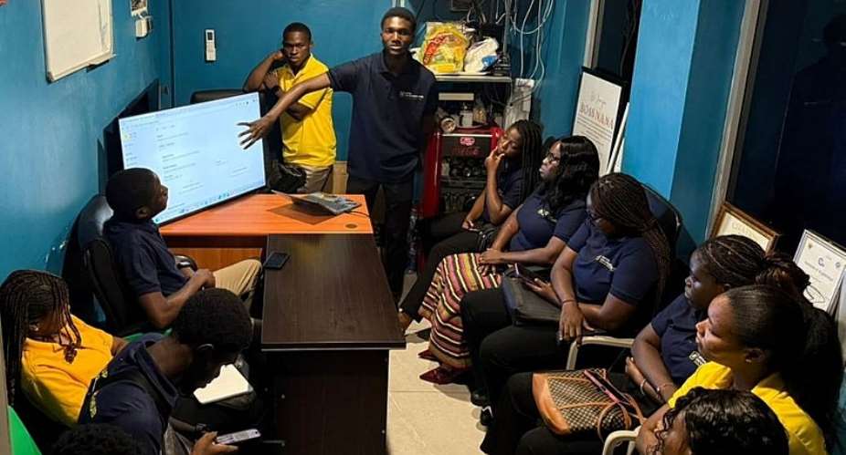 Albert Siaw Yeboah, Lead of the UPSA Developers Hub demonstrates the Tix4u platform to staff of Silverbird Cinemas Ghana during the academic-industry engagement at Accra Mall.