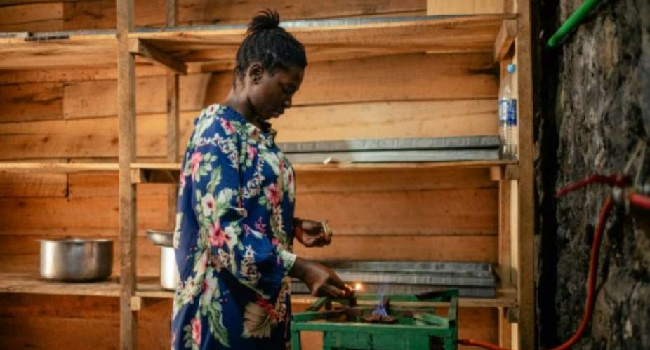 Locally produced biogas is a cheaper option for people in Goma in eastern DR Congo.  By Jospin Mwisha (AFP)