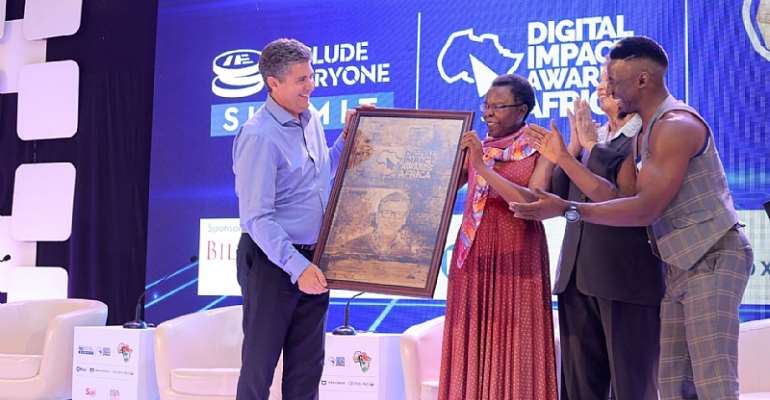 Dr. Warren D Carew Receives Africa Financial Inclusion Medal of Honor on Behalf of Bill Gates