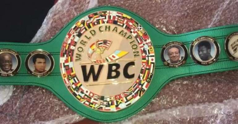 WBC Awards DK Poison A New Belt With Akufo-Addo Image Embossed