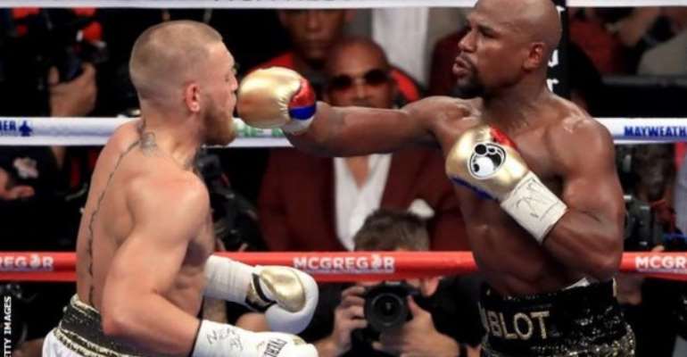 Mayweather (right) and McGregor met in on the richest bouts in boxing history