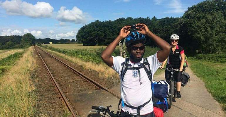 Ghanaian Cycles 19 Days from Denmark to Swansea to fight against Illegal Migration
