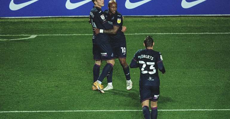 Andre Ayew celebrating with teammates after scoring against Coventry City on Tuesday night. Photo Credit/Swansea City