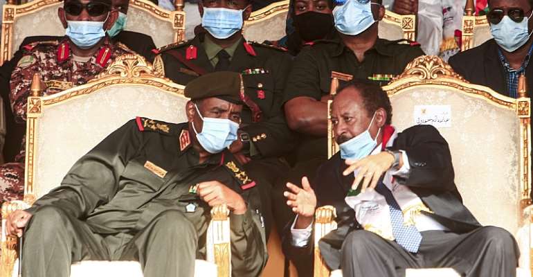 General Abdel Fattah al-Burhan, left, and Prime Minister Abdalla Hamdok at an October 2020 ceremony celebrating the peace deal. - Source: Ebrahim Hamid/AFP via Getty Images