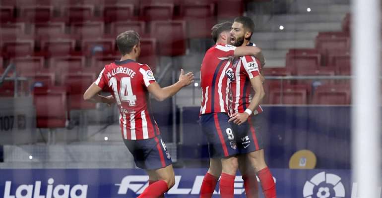 Yannick Carrasco of Atletico de Madrid celebrates with teammate Marcos Llorente and Saul Niguez after scoring his team's first goal during the La Liga Santander match between Atletico de Madrid and FC Barcelona at Estadio Wanda Metropolitano
Image credit: Getty Images